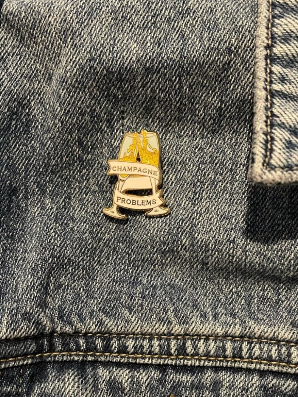 Champagne Problems Enamel Pin | Bookish Music Inspired Lapel Badge